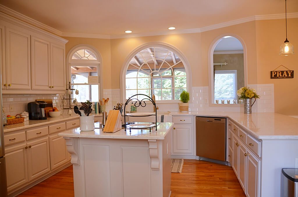 Kitchen Remodel in Roswell with new cabinets and doors with corbels under Wording under picture is New cabinets and doors with corbels under for Roswell Kitchen Remodel