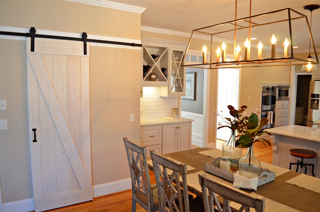 Kitchen Remodel in Roswell has resized pantry and new lighting Wording under picture is Resized pantry and new pendant lighting for the Roswell Kitchen Remodel